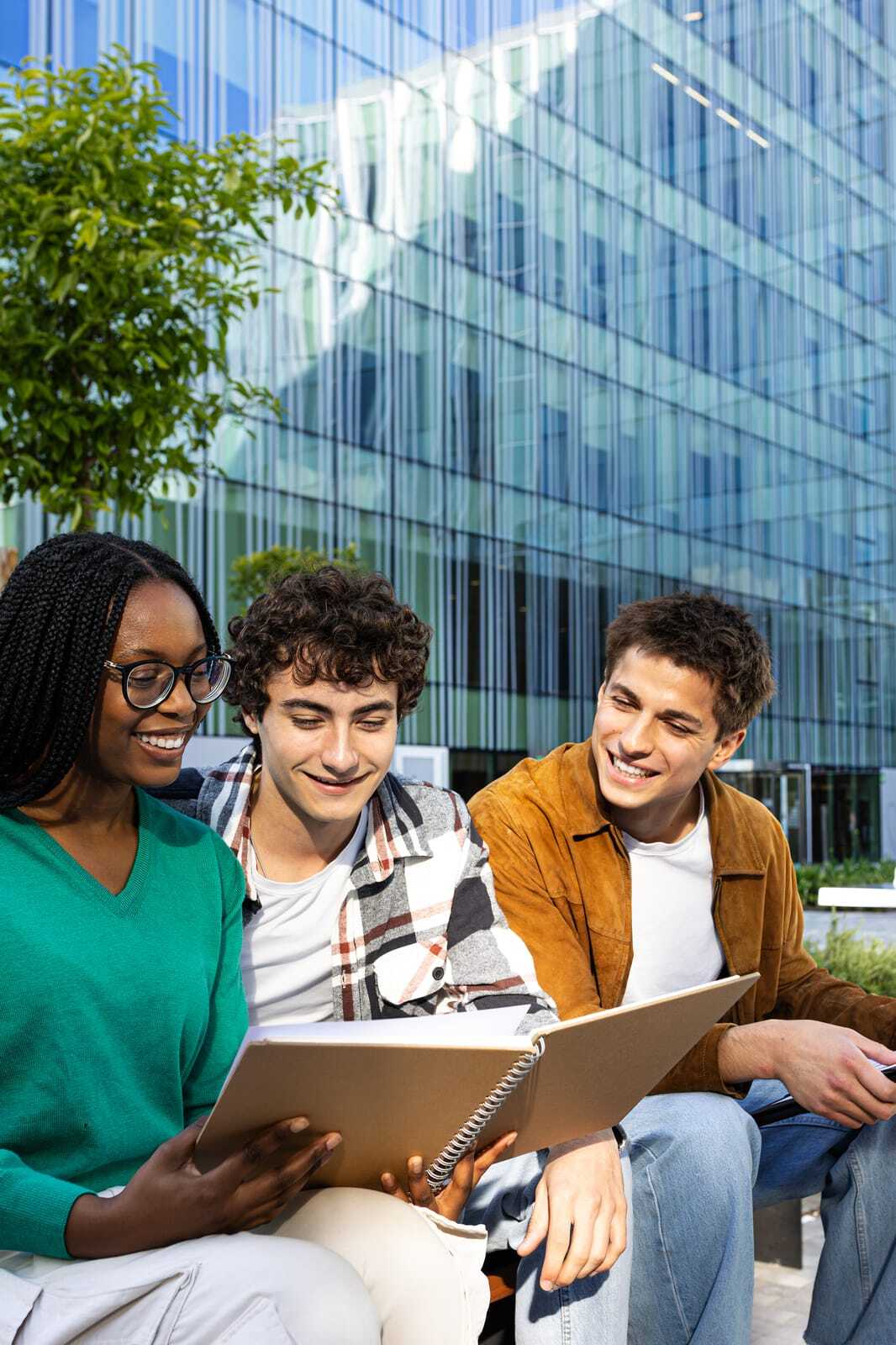 97863290_university-students-studying-together-outdoors-on-campus